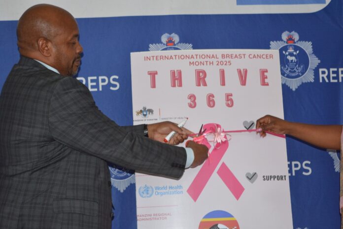 The Minister of Health Mduduzi Matsebula cutting the ribbon to mark the official launch of the 2025 International Breast Cancer Awareness Month.