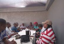 Manzini Wanderers leadership under siege NSC chairperson Mthunzi Dlamini raising a point during the meeting on Sunday while the others listen.