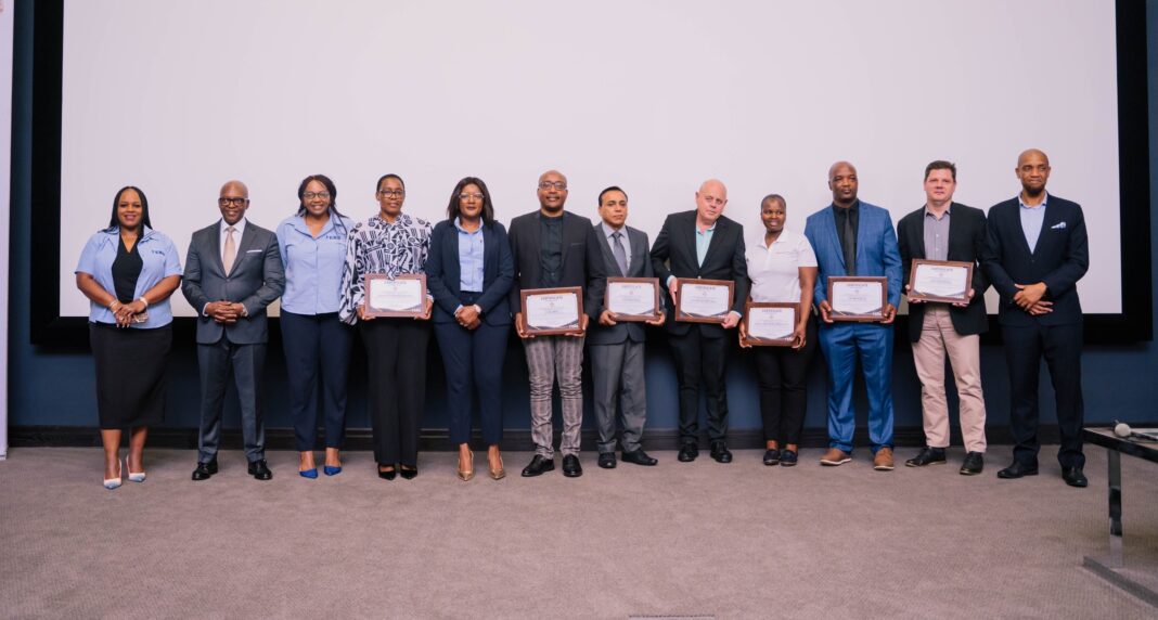 589730686_717283891417031_4978712729347843176_n ERS Commissioner General Brightwell Nkambule, BE Chief Executive Officer E. Nathi Dlamini with accredited company representatives during the accreditation ceremony of seven companies, under the AEO programme held at ERS Headquarters in Ezulwini yesterday. (Pic: Nokuzola Thwala)