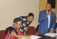 Introspect, church leader urges Christians Facilitator of the consultations Sidumo Malindisa making his statement while Minister of Home Affairs Princess Lindiwe signs some documents at the start of the meeting. (Pic: Mduduzi Mngomezulu)