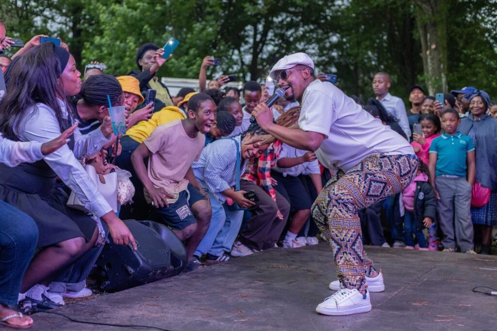 Sands sharing a moment with the audience during his performance.