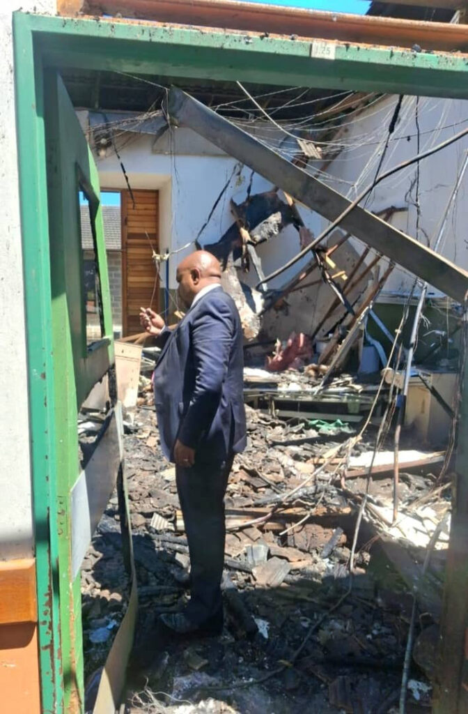 Matsebula assesses the damage to one of the wards that caught fire.