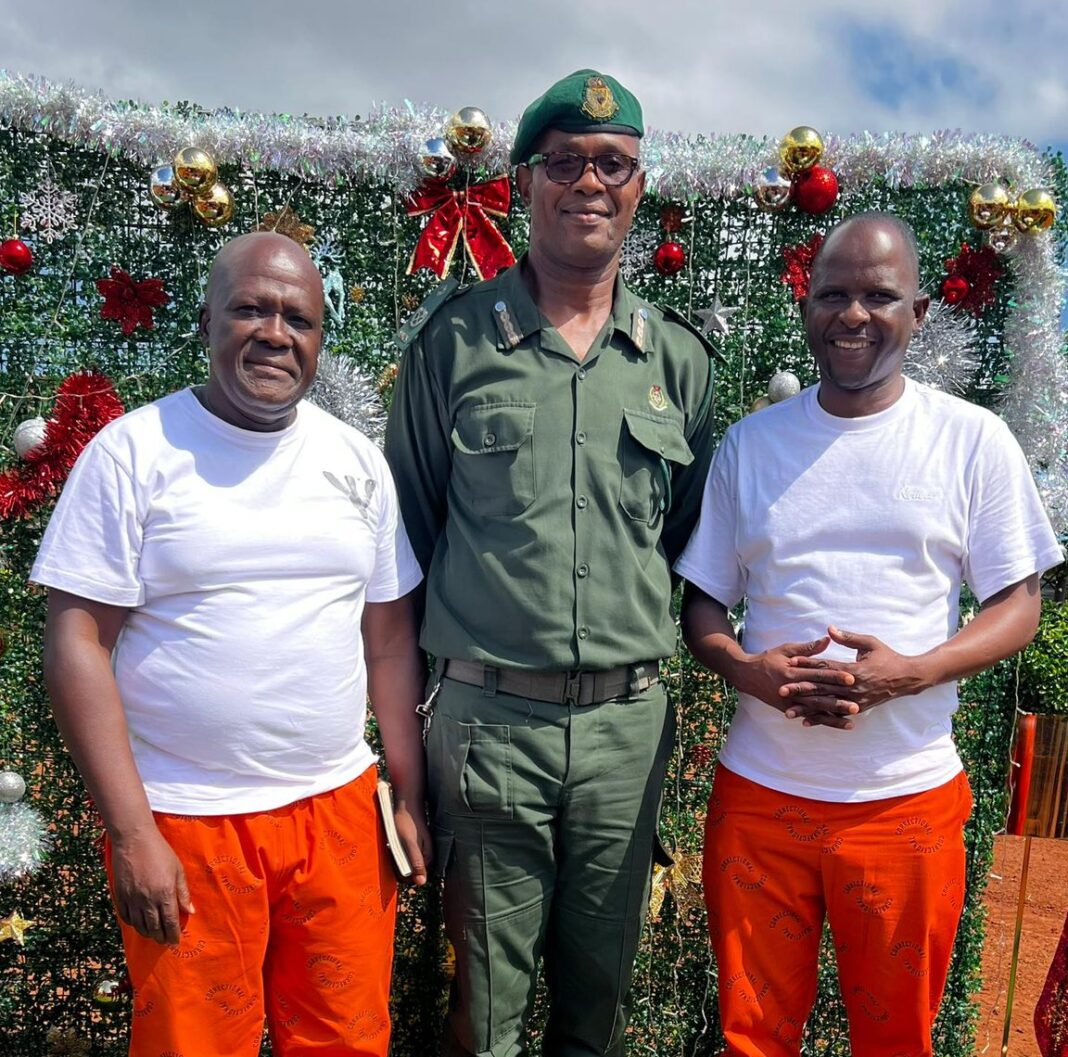 Convicted businessman Sipho Shongwe and former Member of Parliament Mduduzi Mabuza with a correctional officer.