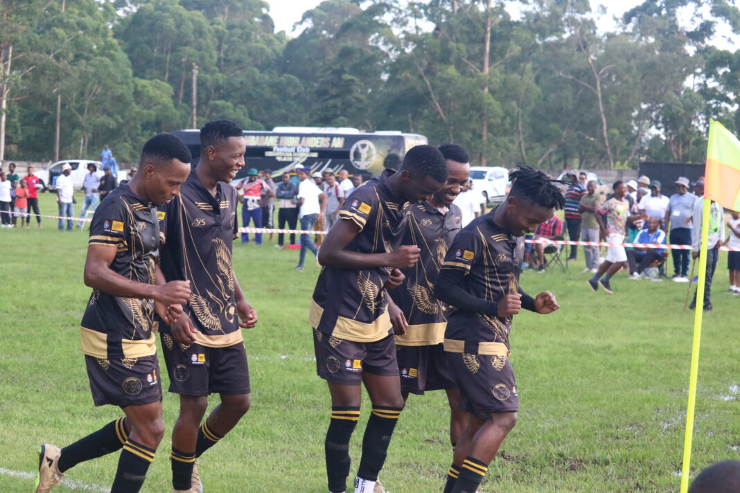 Goalscorer Hopewell Cele leads his teamate in celebration.