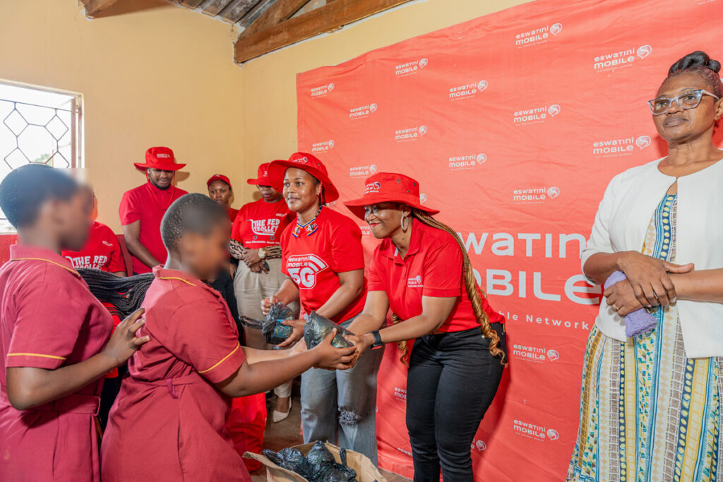Sindela Mdluli handing out the sanitary pads.