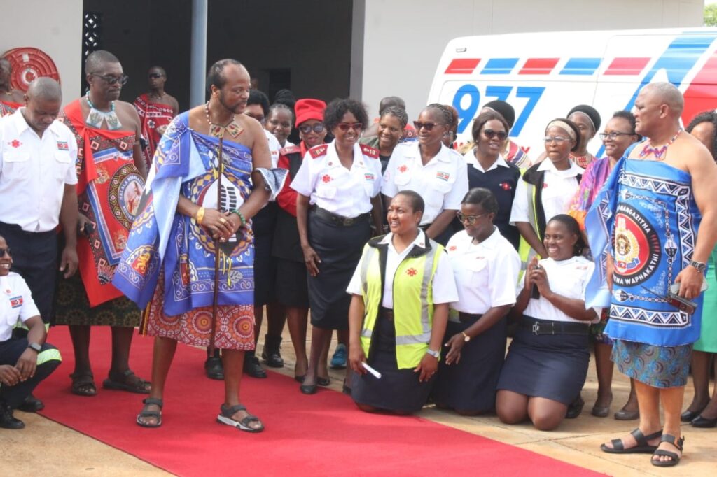 The king leaves after taking a group photo with the paramedics during the event.