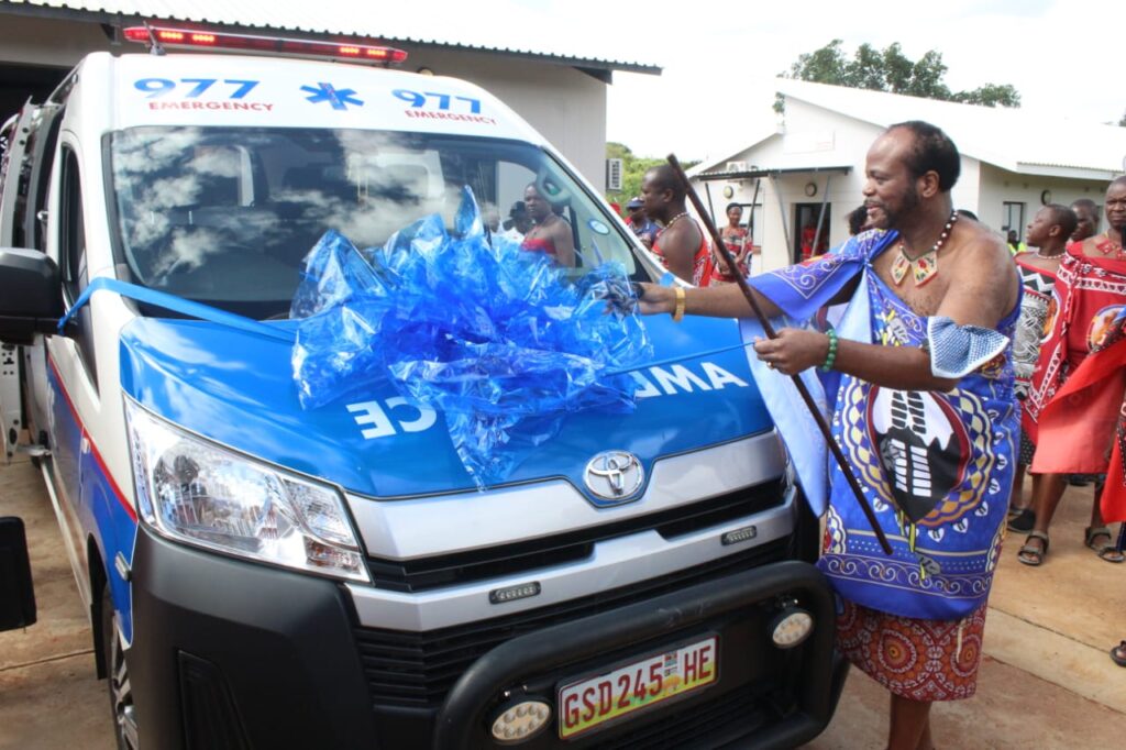 His Majesty King Mswati III cuts the ribbon to officially hand over one of the six ambulances worth over E13 million during the opening of Esicacweni Setemphilo Clinic at Mshinande in the Northern Hhohho yesterday.