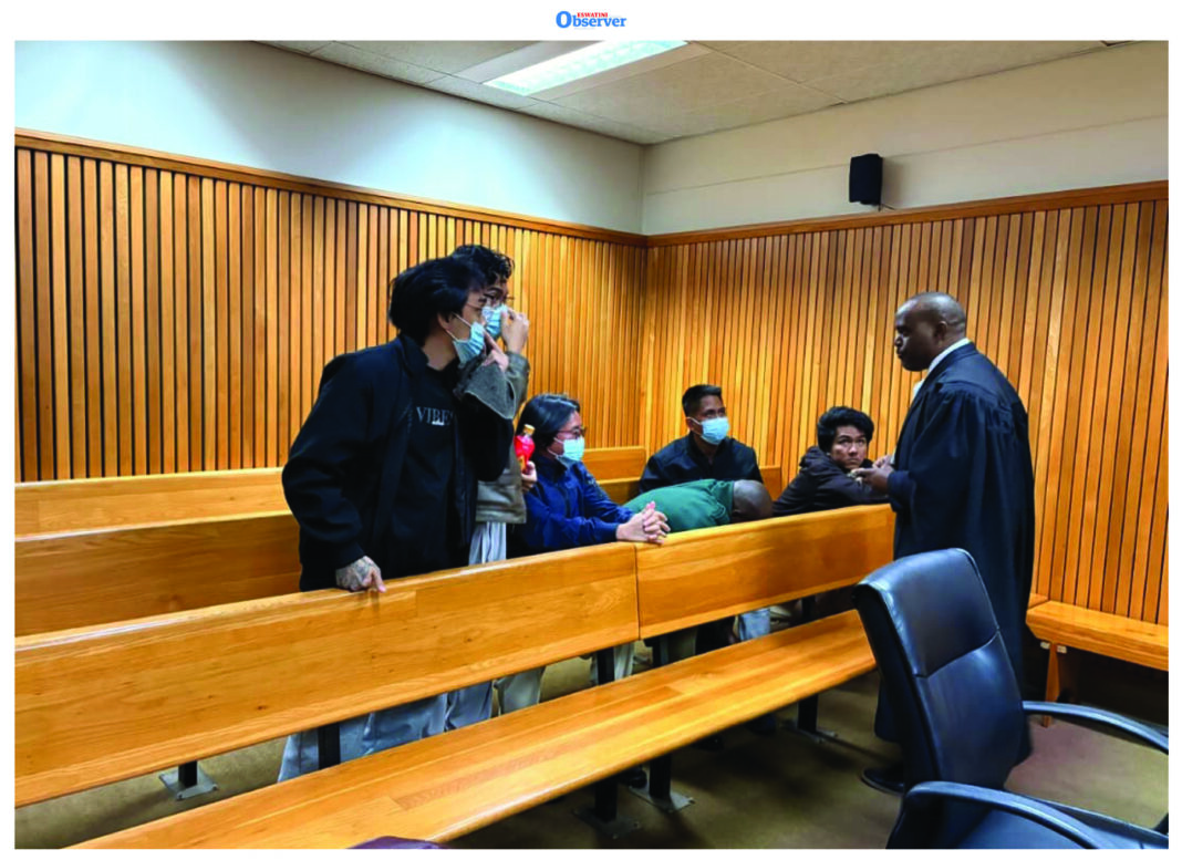 The Filipinos who were arrested for illegal online gambling at the High Court with their lawyer Sifiso Jele.